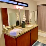 A bathroom with a sink and towels